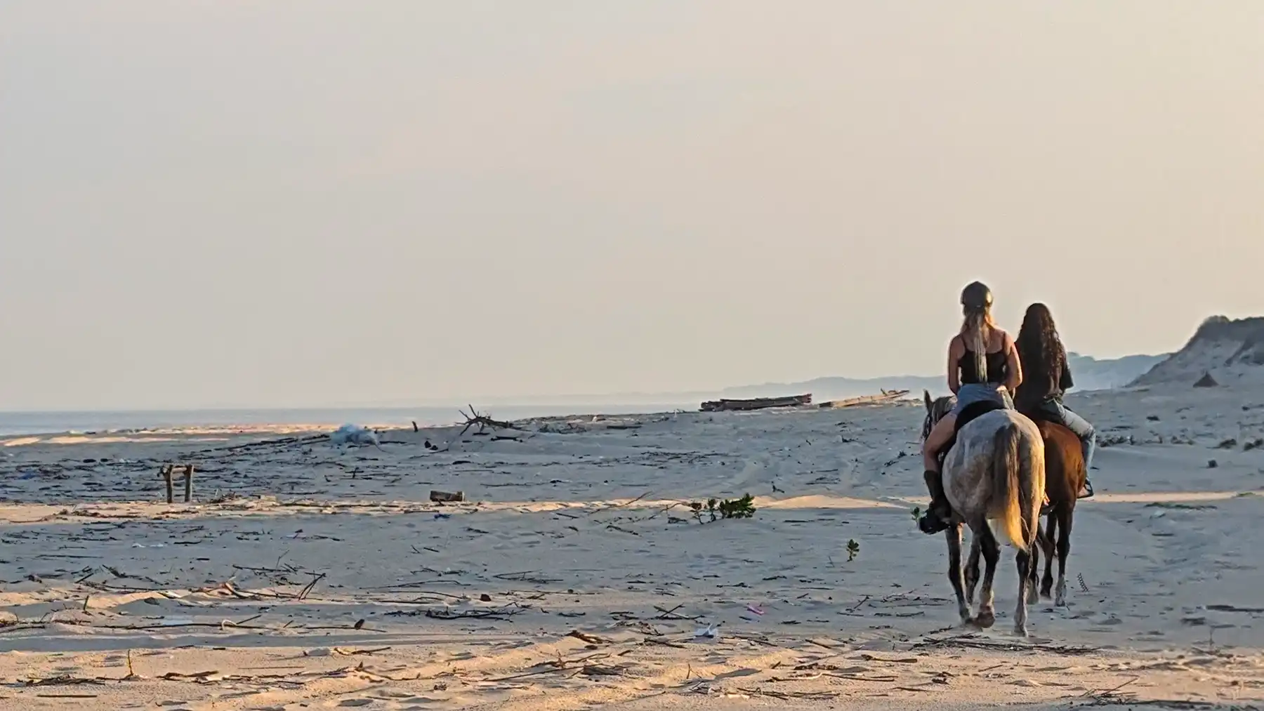 Riding on the beach at sunset