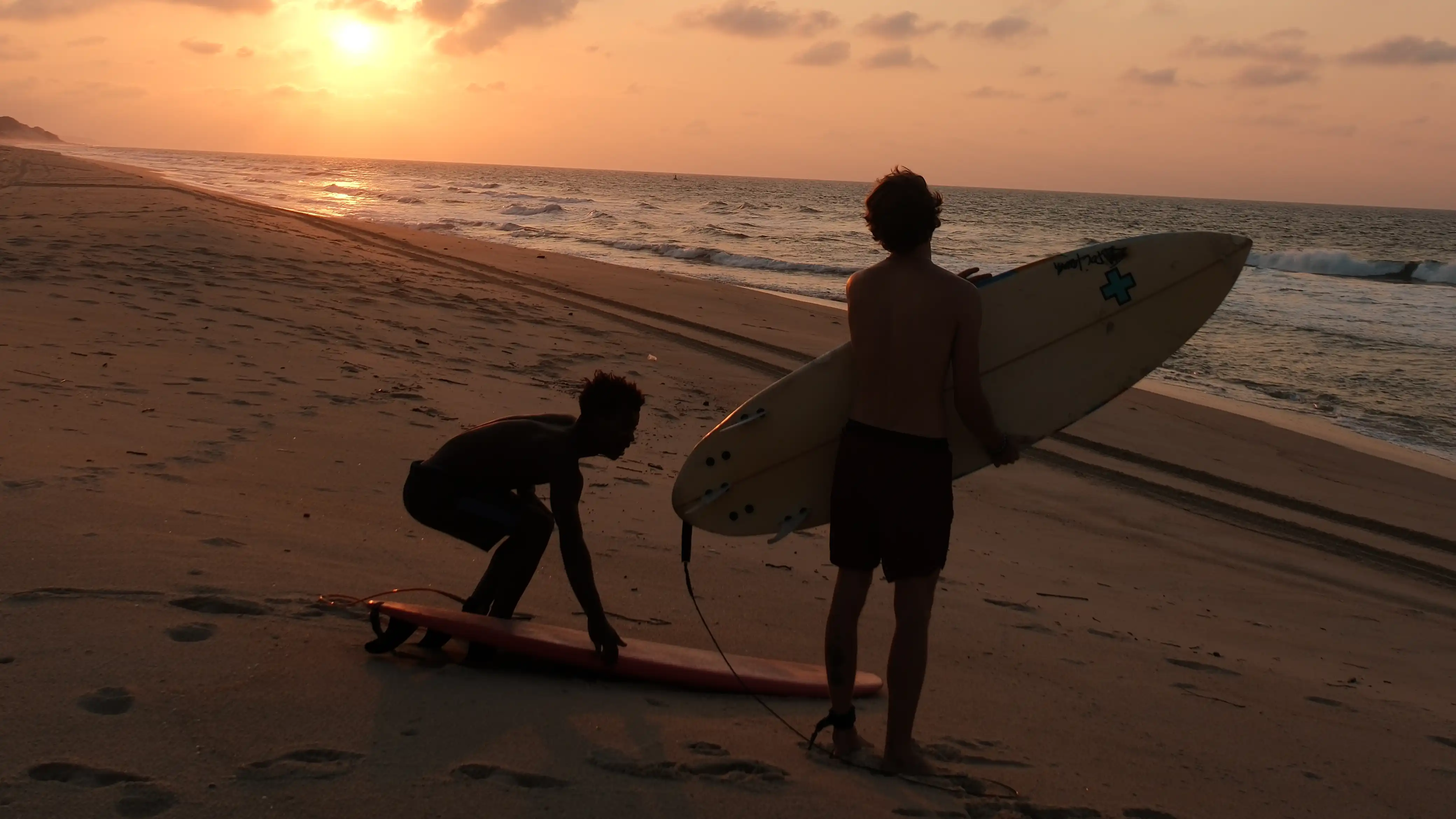 Surfing at sunset